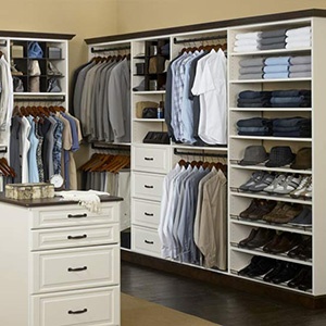 Organized closet with clothes and shoes.